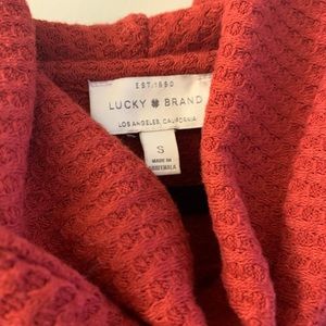 Red swoop next sweater